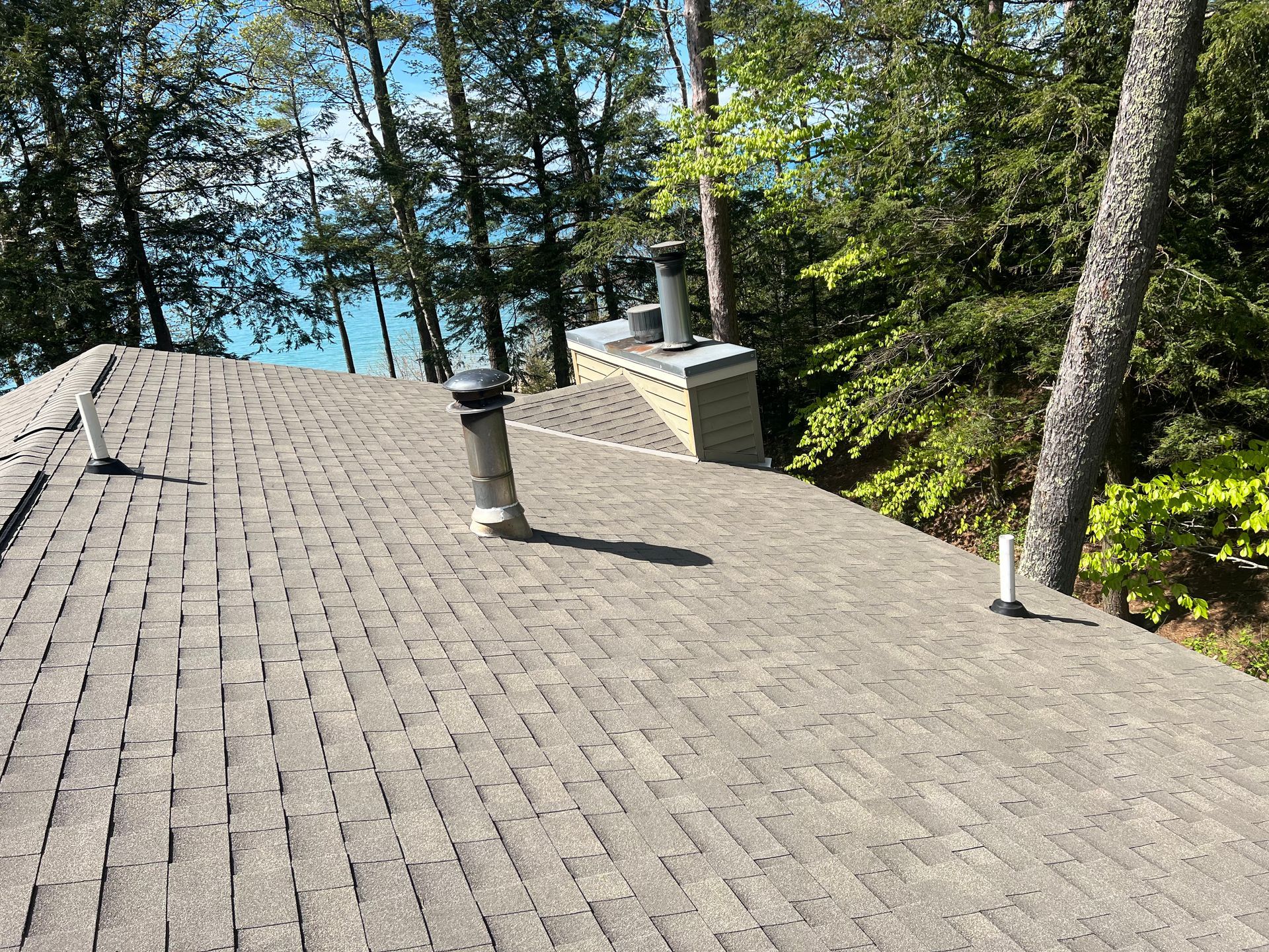 High-quality asphalt shingle roof installed on a two-story home
