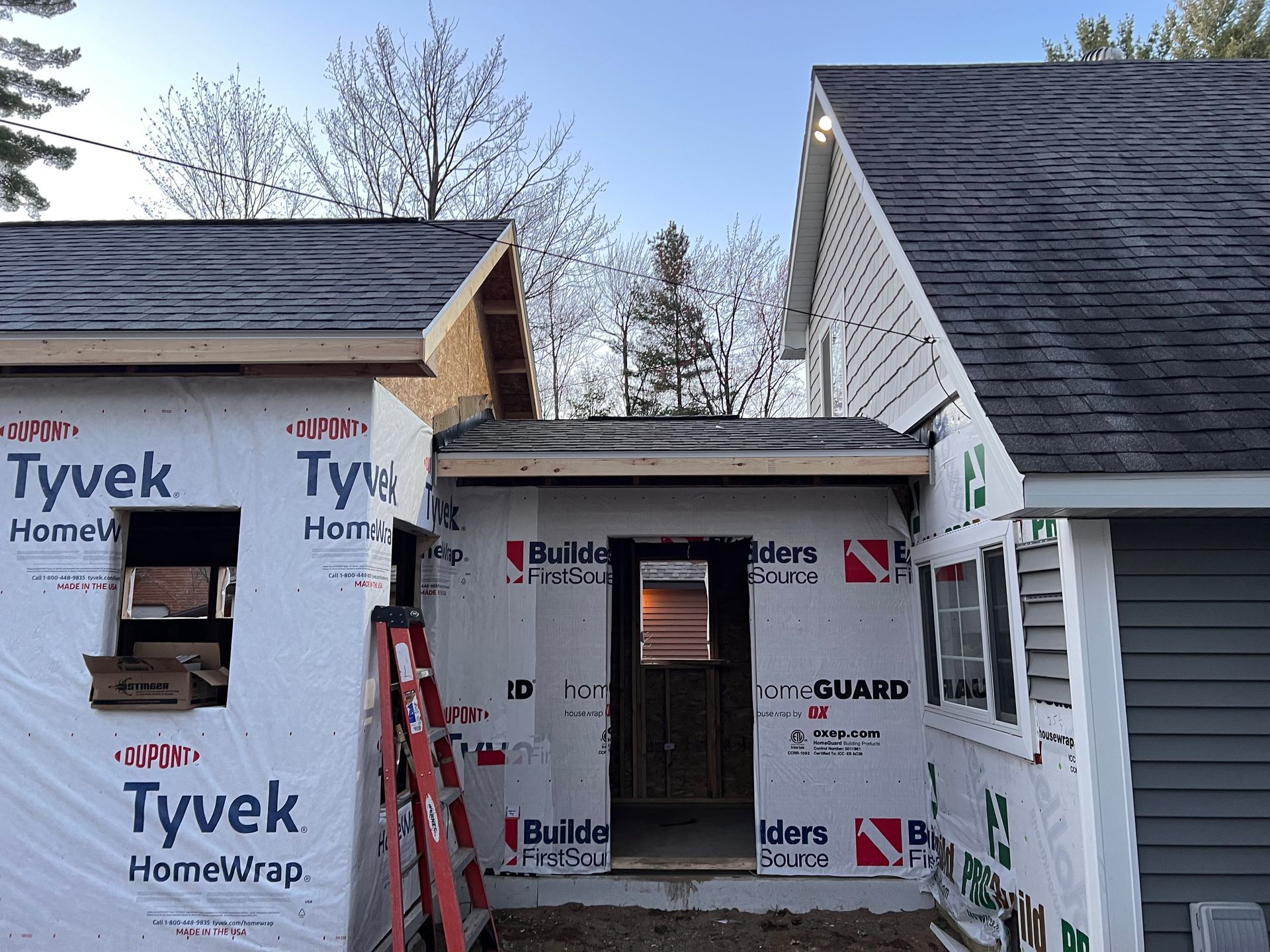 Single story home with underlayment for siding replacement by Alpine Brothers Construction.