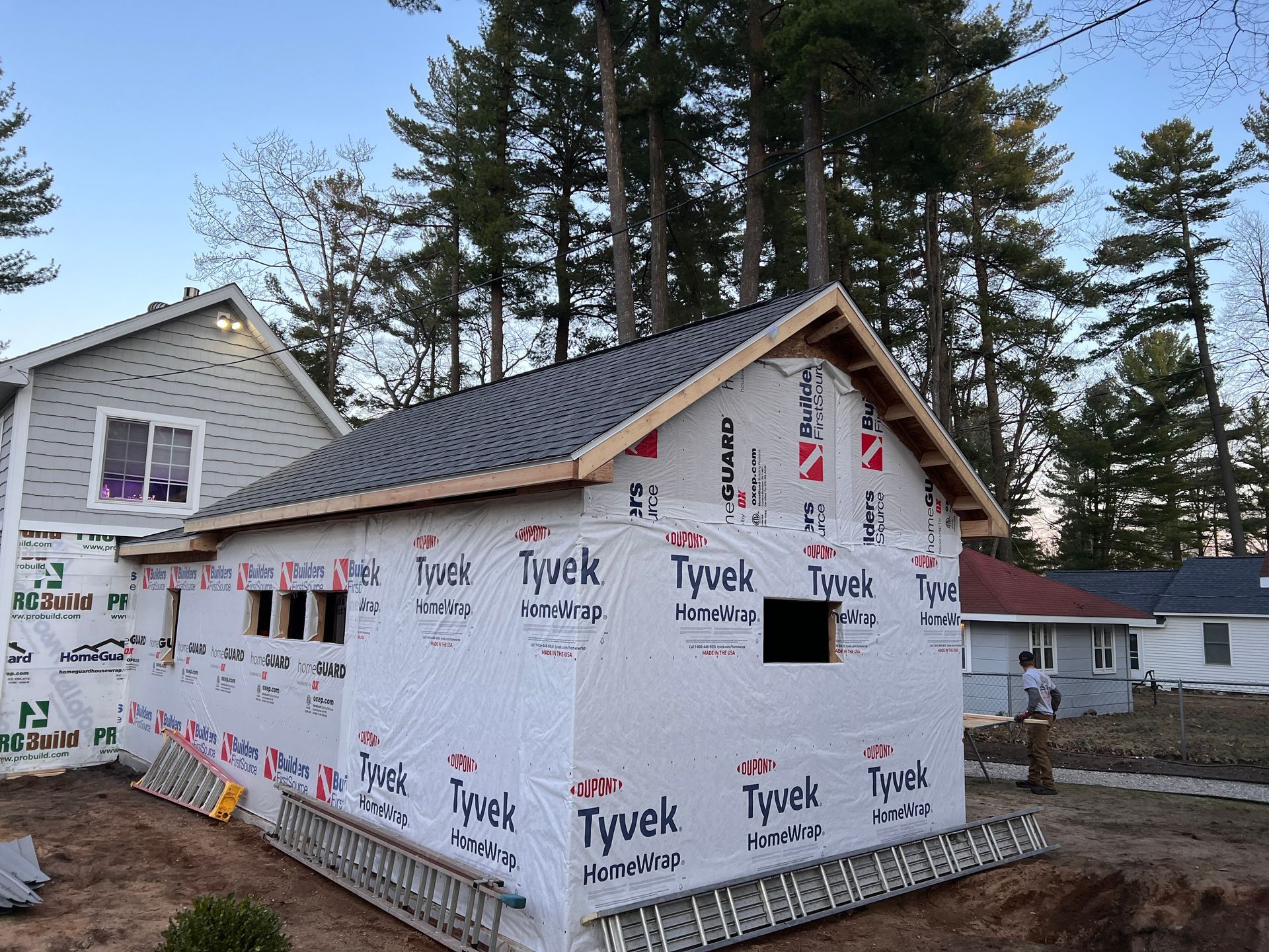 A new home addition project featuring vinyl siding and asphalt shingle roofing installation in Gaylord, MI.