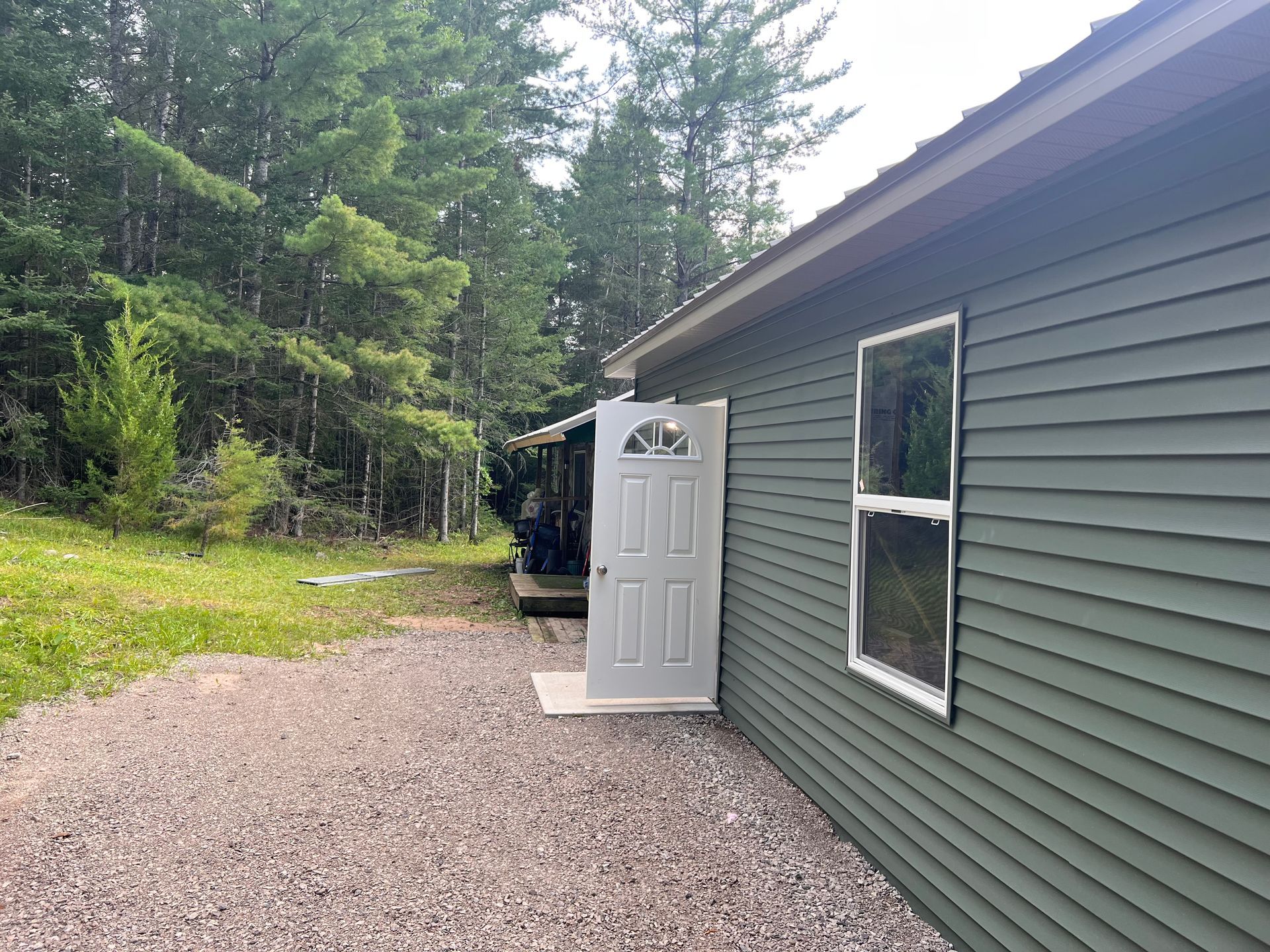Residential vinyl siding, windows, and door installation in Gaylord, MI.