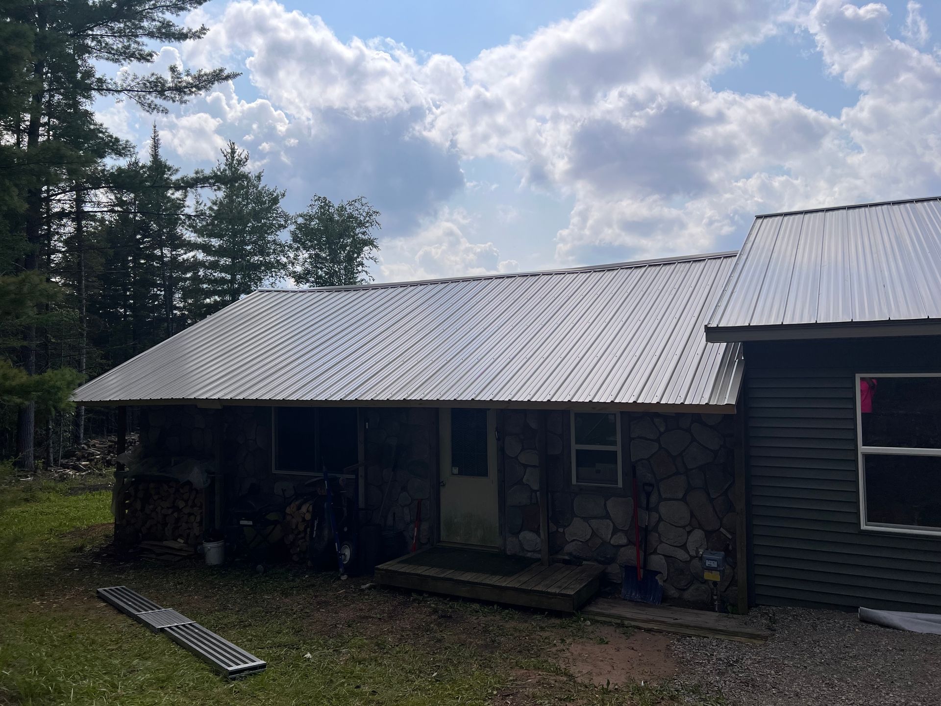 Single-story home in Gaylord, MI with a metal roof replacement.