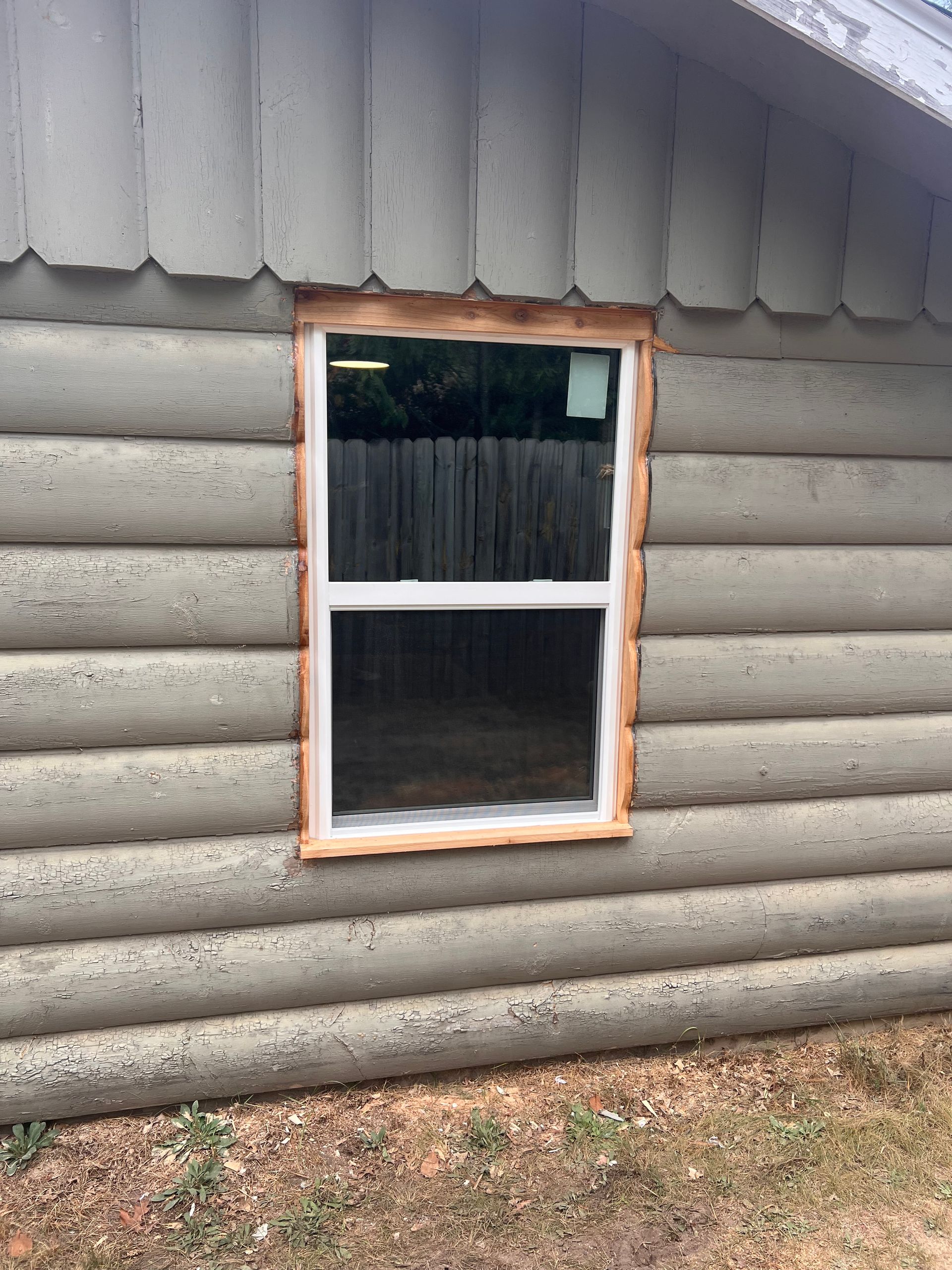 Close up image of a window installation by Alpine Brothers Construction
