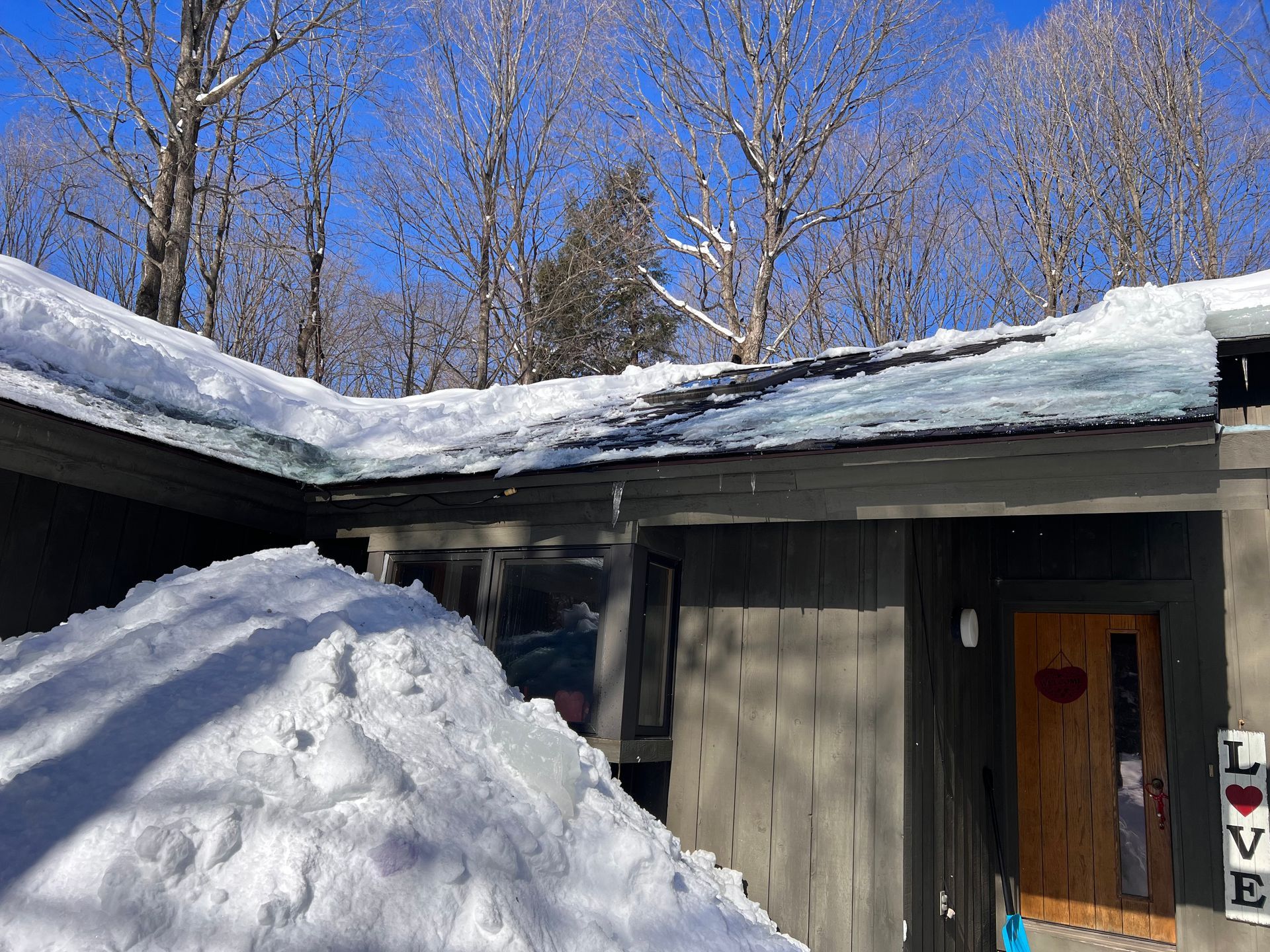 Residential roof after ice dam removal in Gaylord, MI.