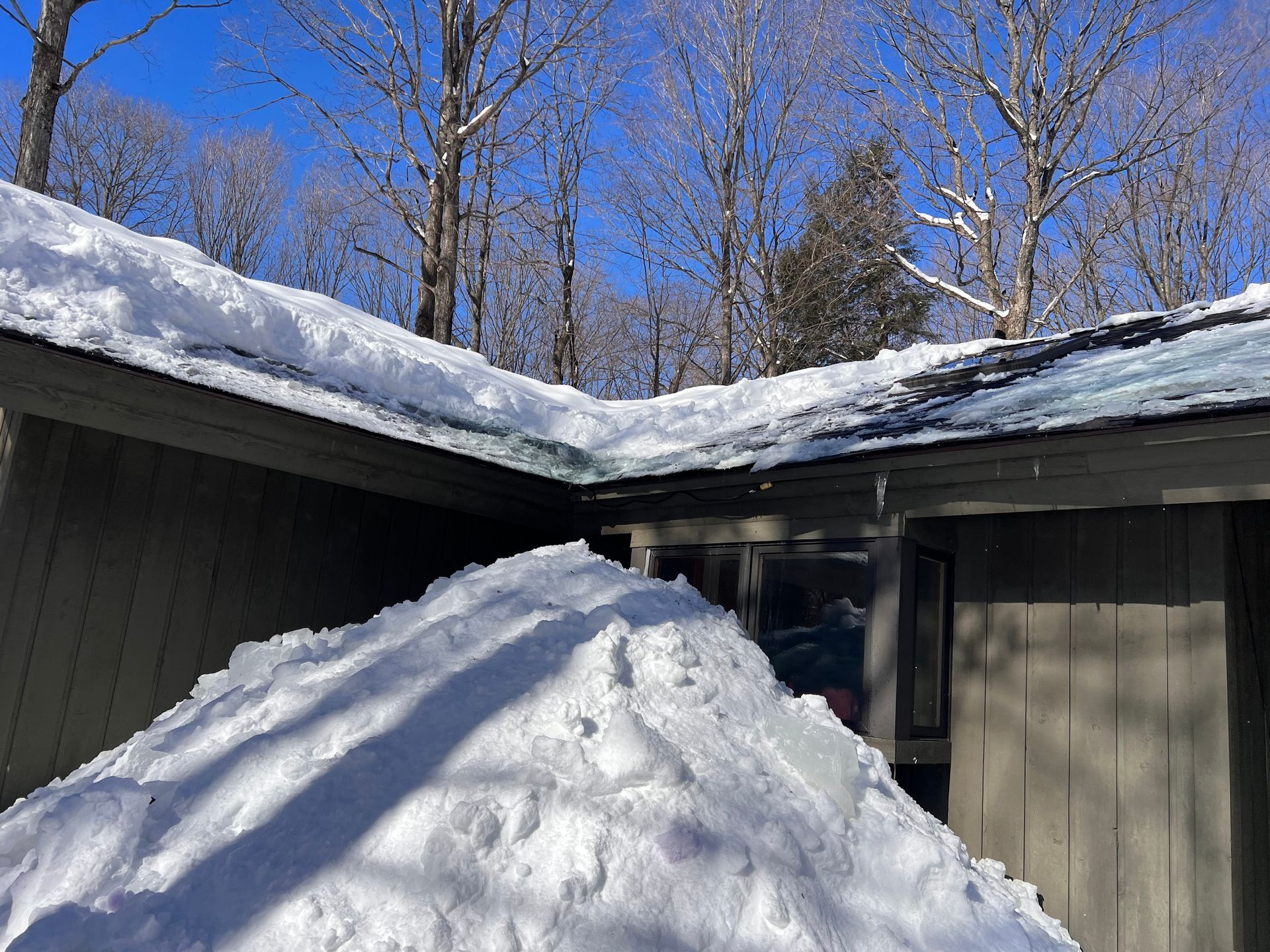 Residential roof after ice dam removal in Gaylord, MI.