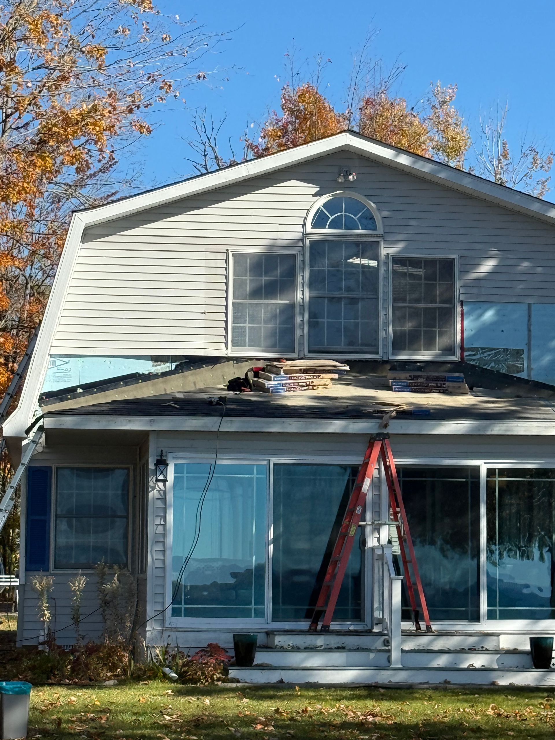 Two-story home in Gaylord, MI with white vinyl siding replacement