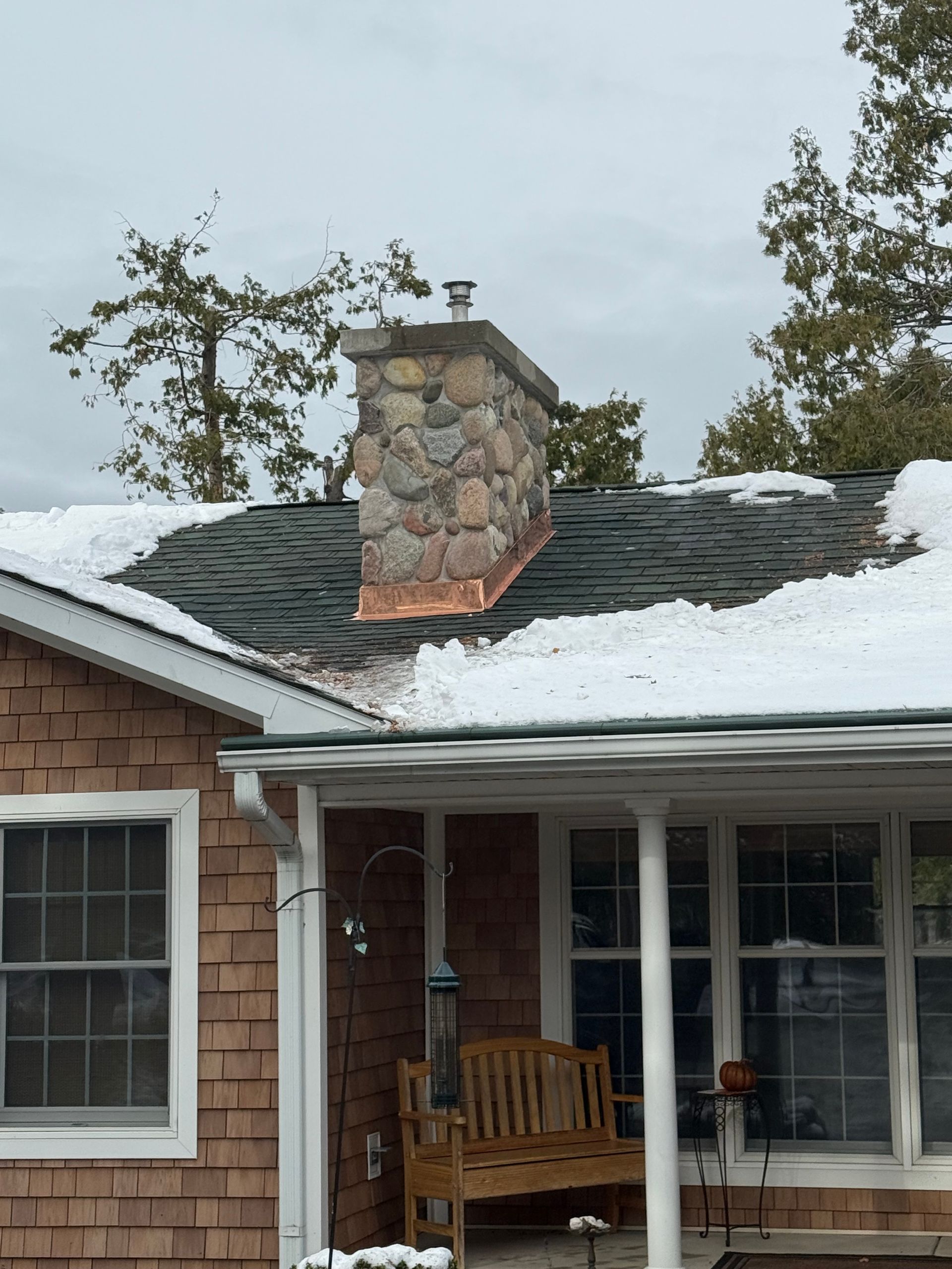 Copper flashing installation on a residential roof in Gaylord, MI.