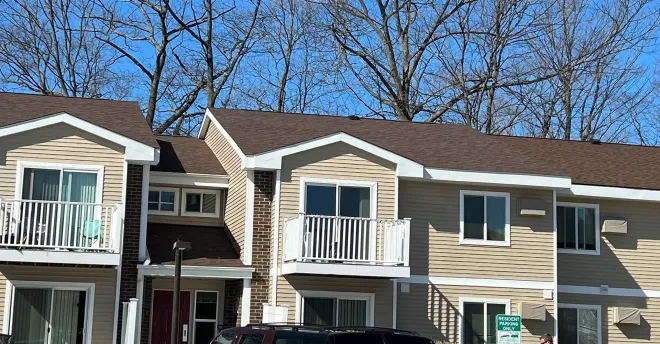 Apartment building in Gaylord, MI with new vinyl siding and asphalt shingle roofing