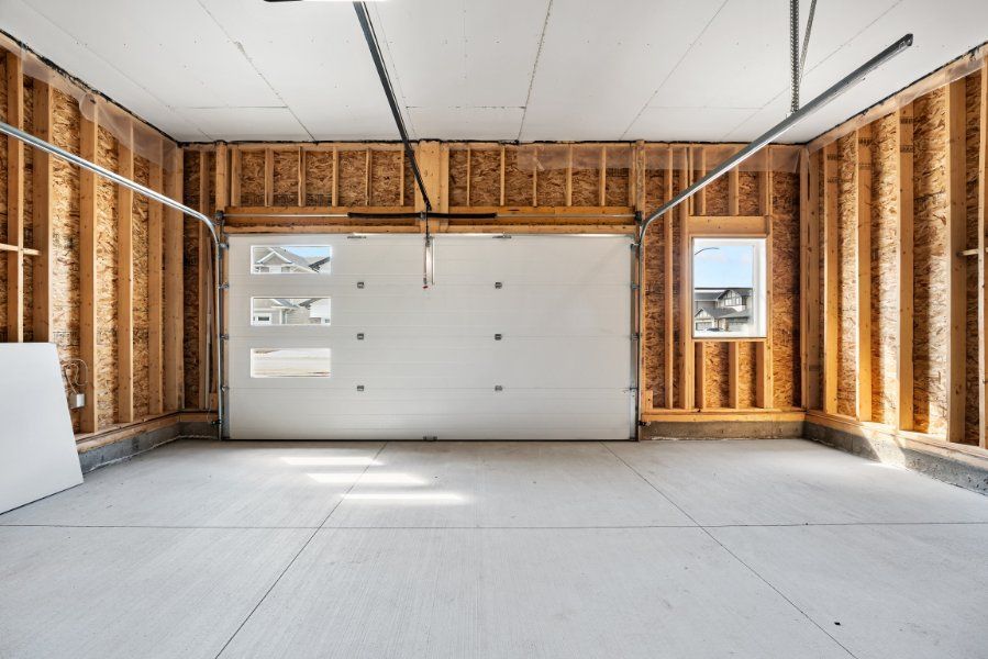 inside view of a garage door with wood walls