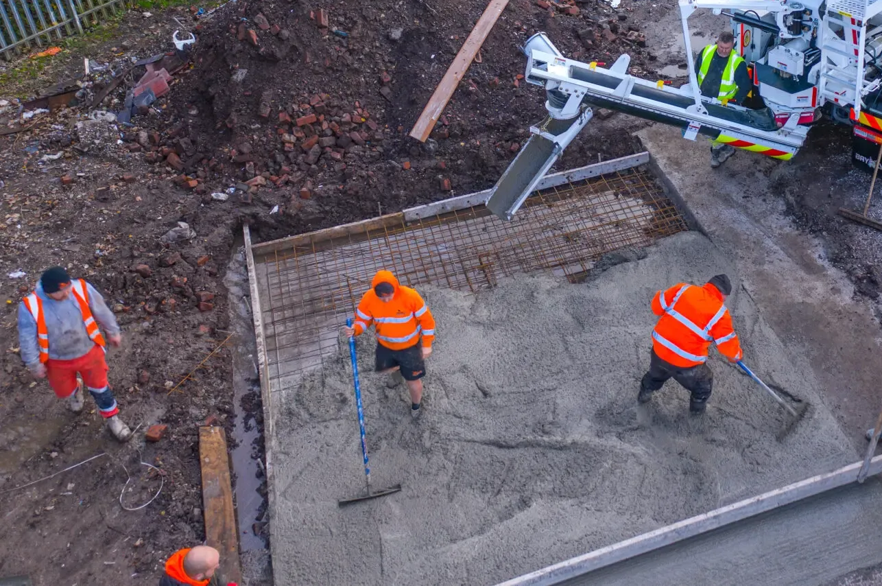 Concrete being poured for house foundations in Rossendale from Volumetric Concrete Wagon from PureMix Concrete, Rochdale