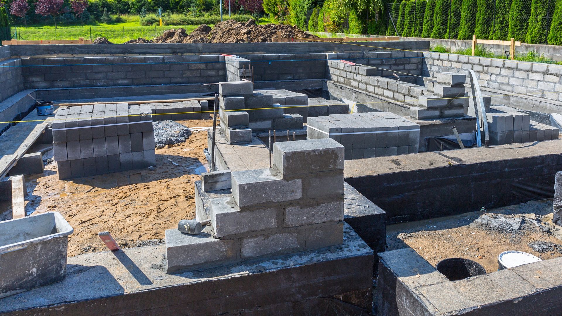 Concrete house foundations and footings on a sunny day. PureMix Concrete. Suppliers of ready mixed concrete in Rochdale.