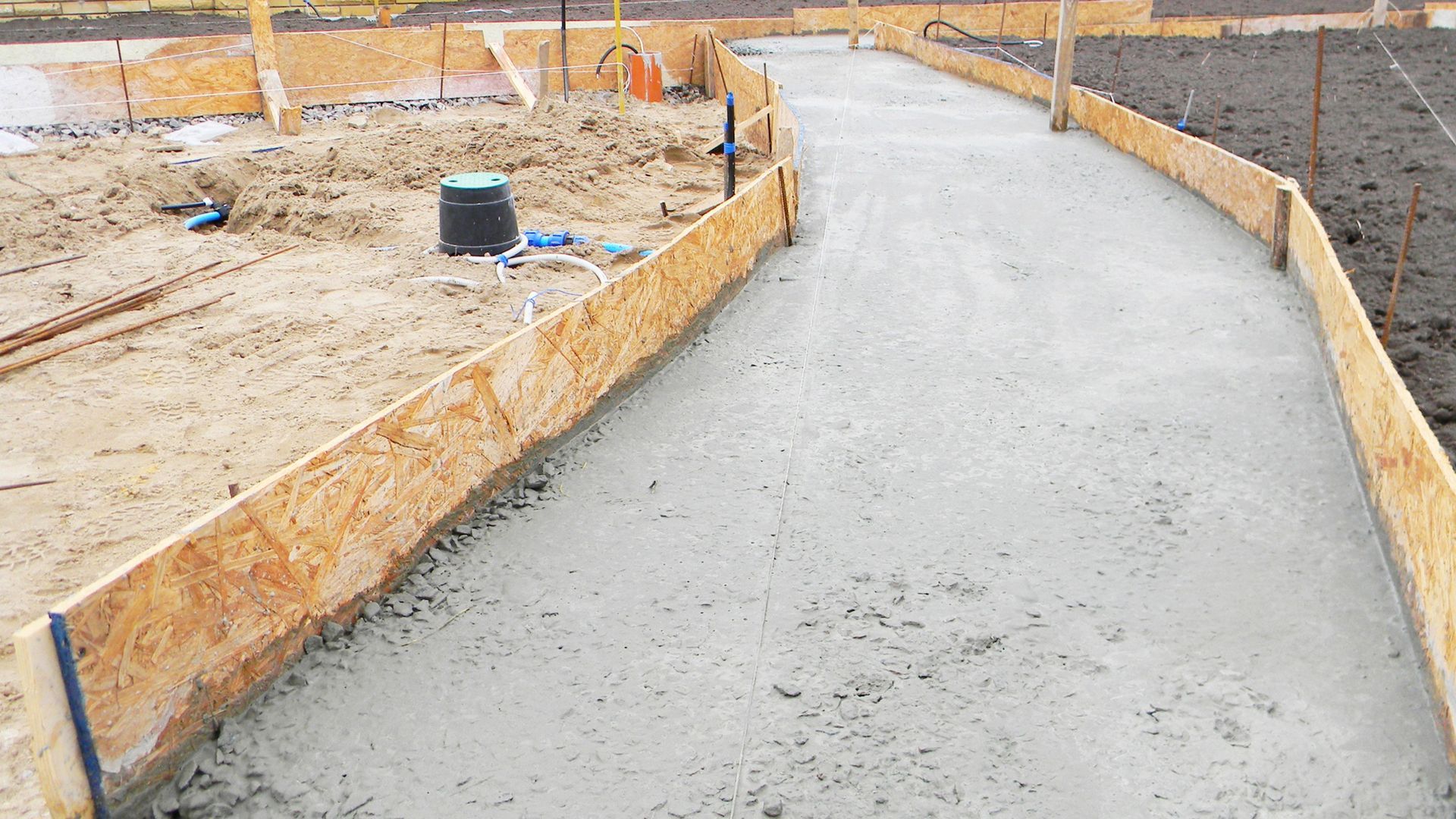 A concrete walkway with concrete ready mixed on site from a volumetric concrete wagon from PureMix Concrete Rochdale