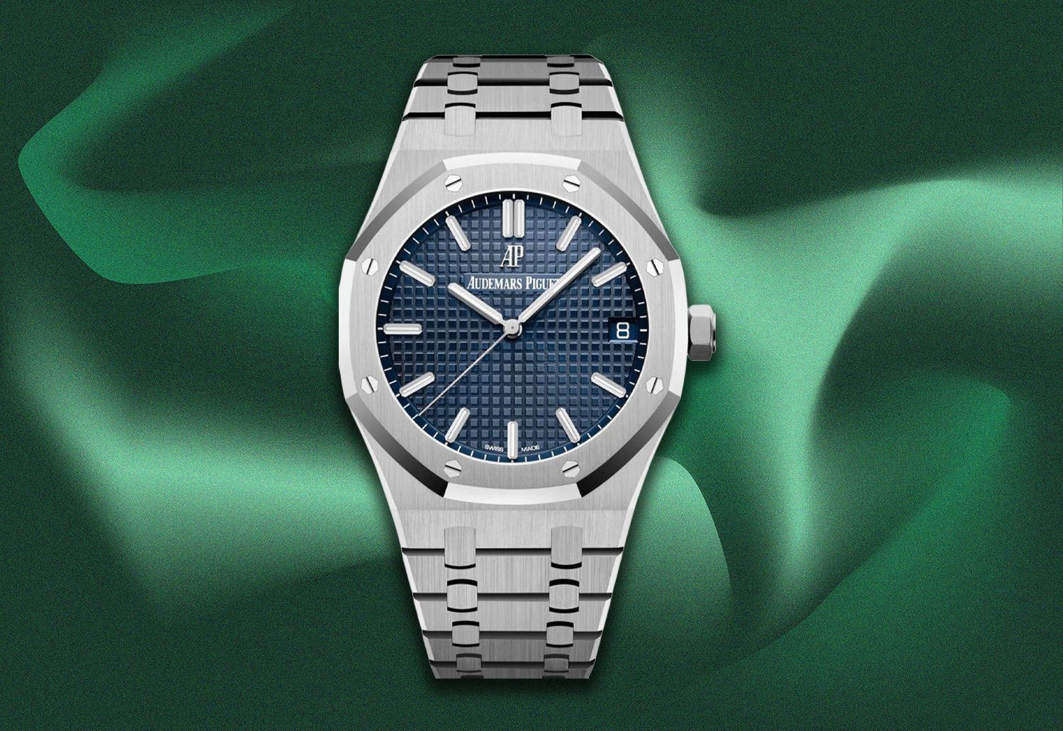 Silver wristwatch with blue dial on a green background.