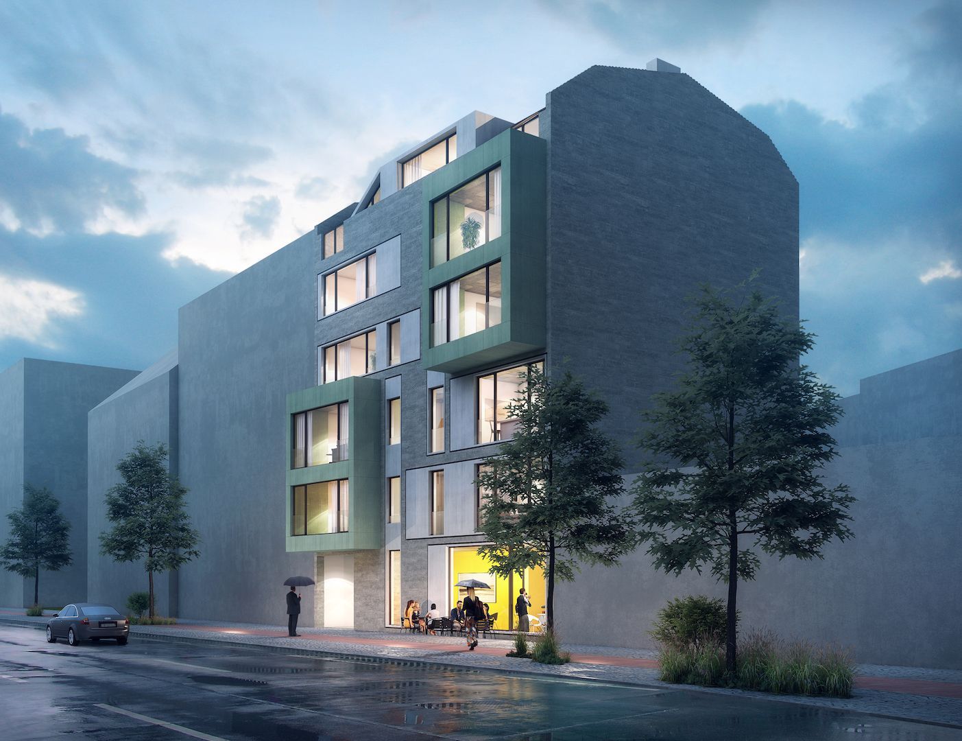 Modernes Gebäude mit grüner Fassade, Fenstern und Fußgängern auf einer regnerischen Straße.