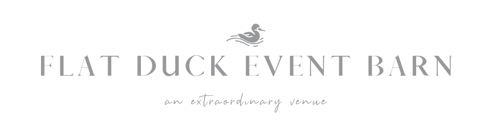 Flat Duck Event Barn logo with a small duck icon and gray text on white background