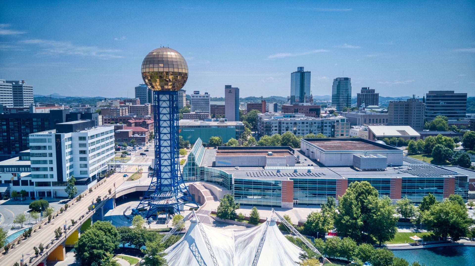 An aerial view of a city with a large dome in the middle of the city.