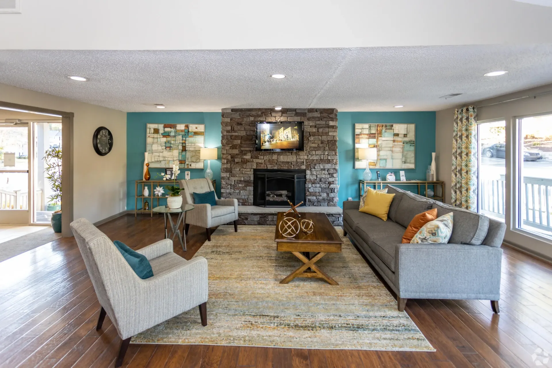 A modern clubhouse room filled with furniture and a fireplace in West Knoxville, TN