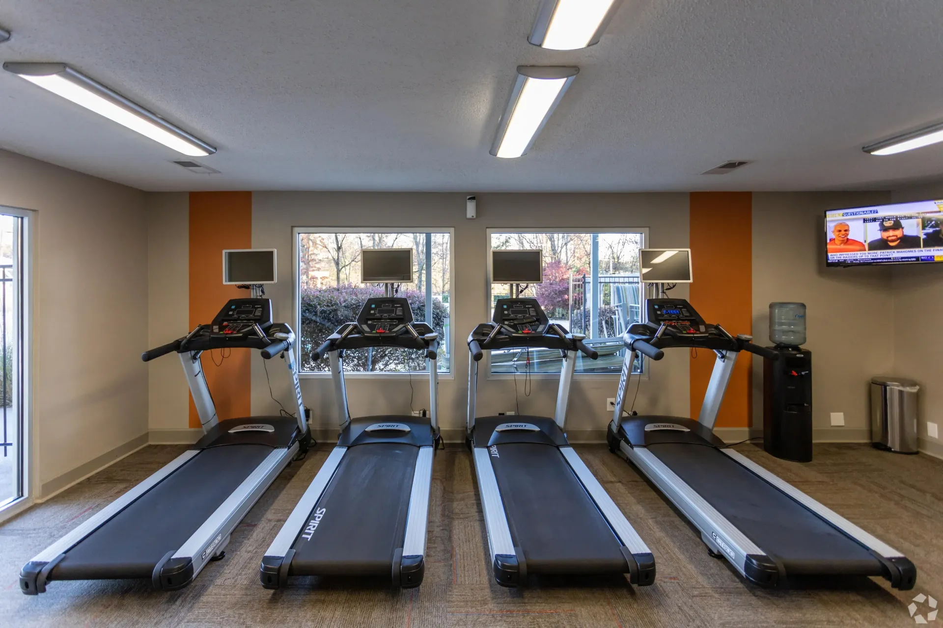 A row of treadmills are lined up in a gym in West Knoxville, TN