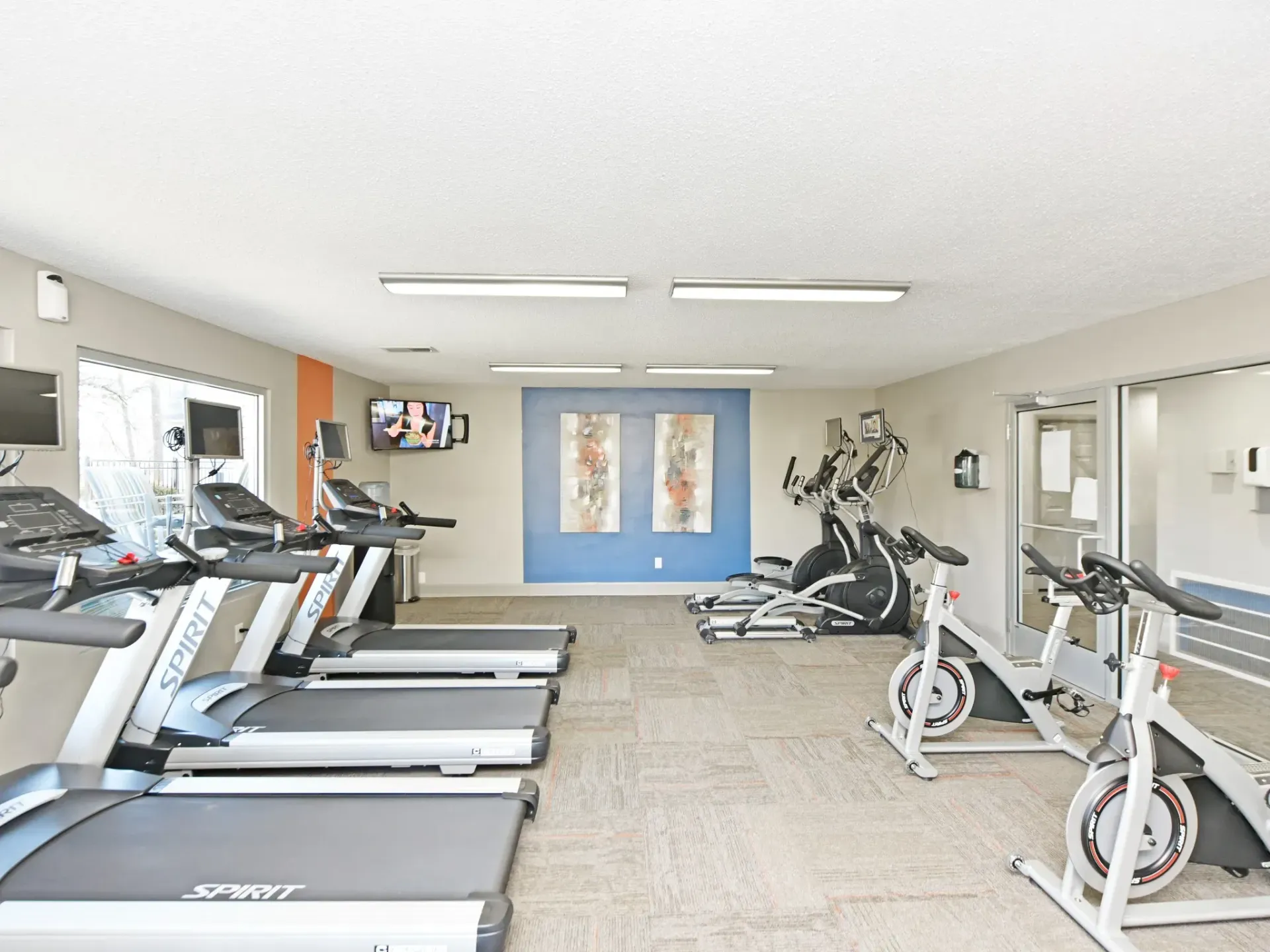 A gym filled with treadmills and exercise bikes in West Knoxville, TN