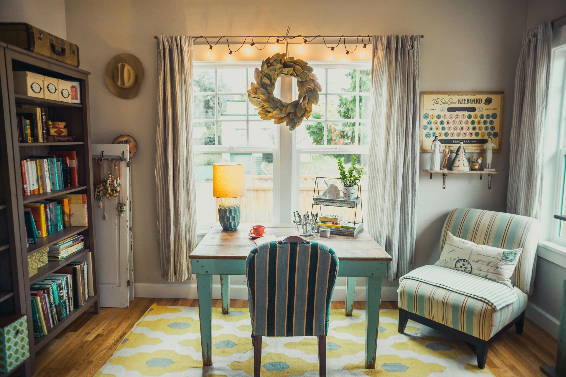 A home office with a desk , chair and bookshelf.