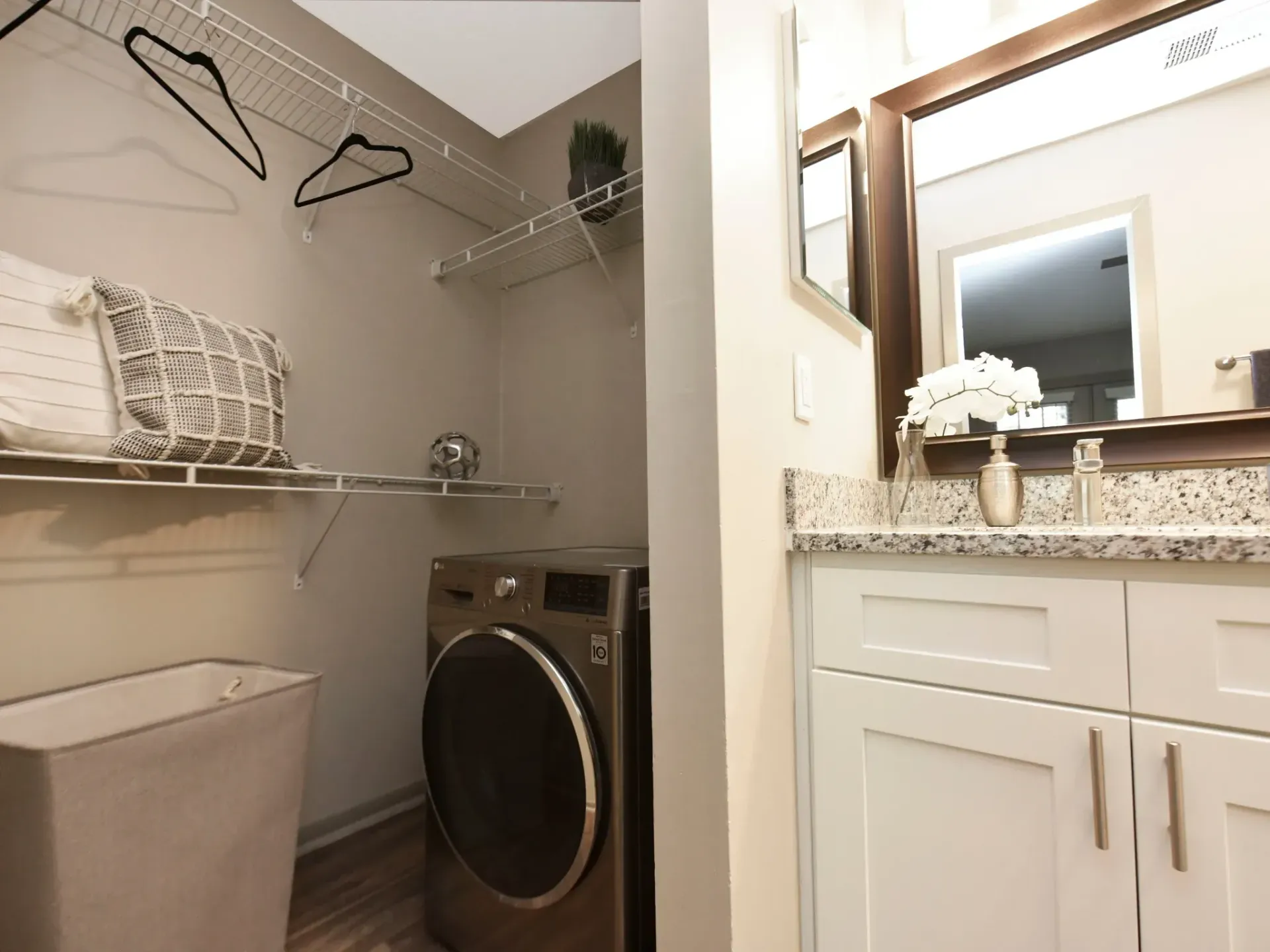 A laundry room with a washer and dryer and a sink in West Knoxville, TN apartment