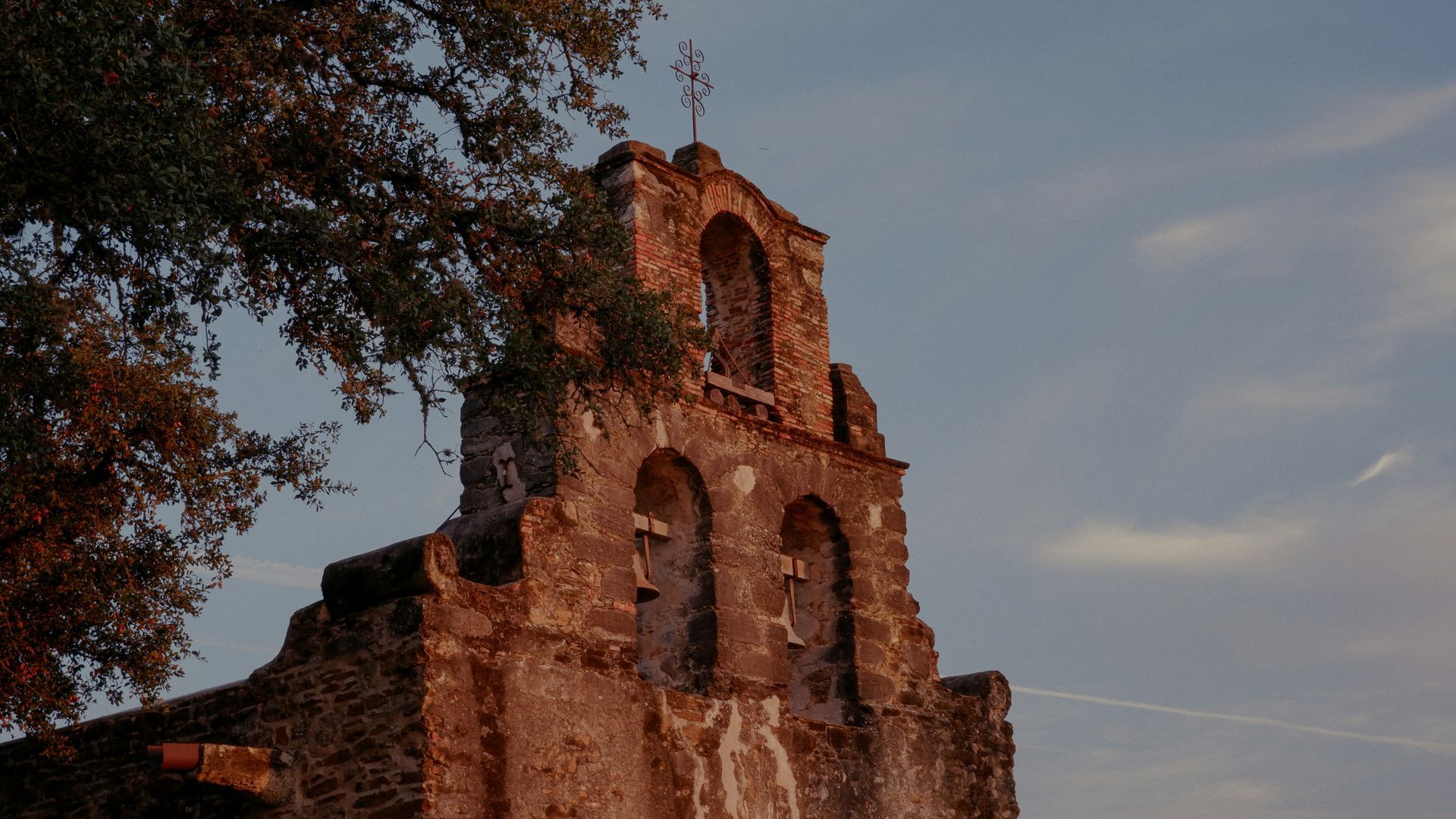 A very old building with a cross on top of it