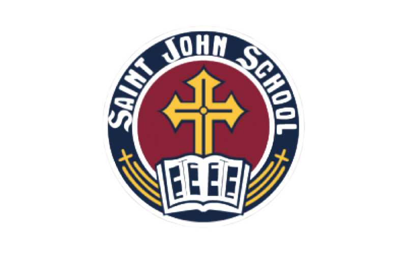 Saint John School logo with a gold cross over an open book on a navy and red circular emblem