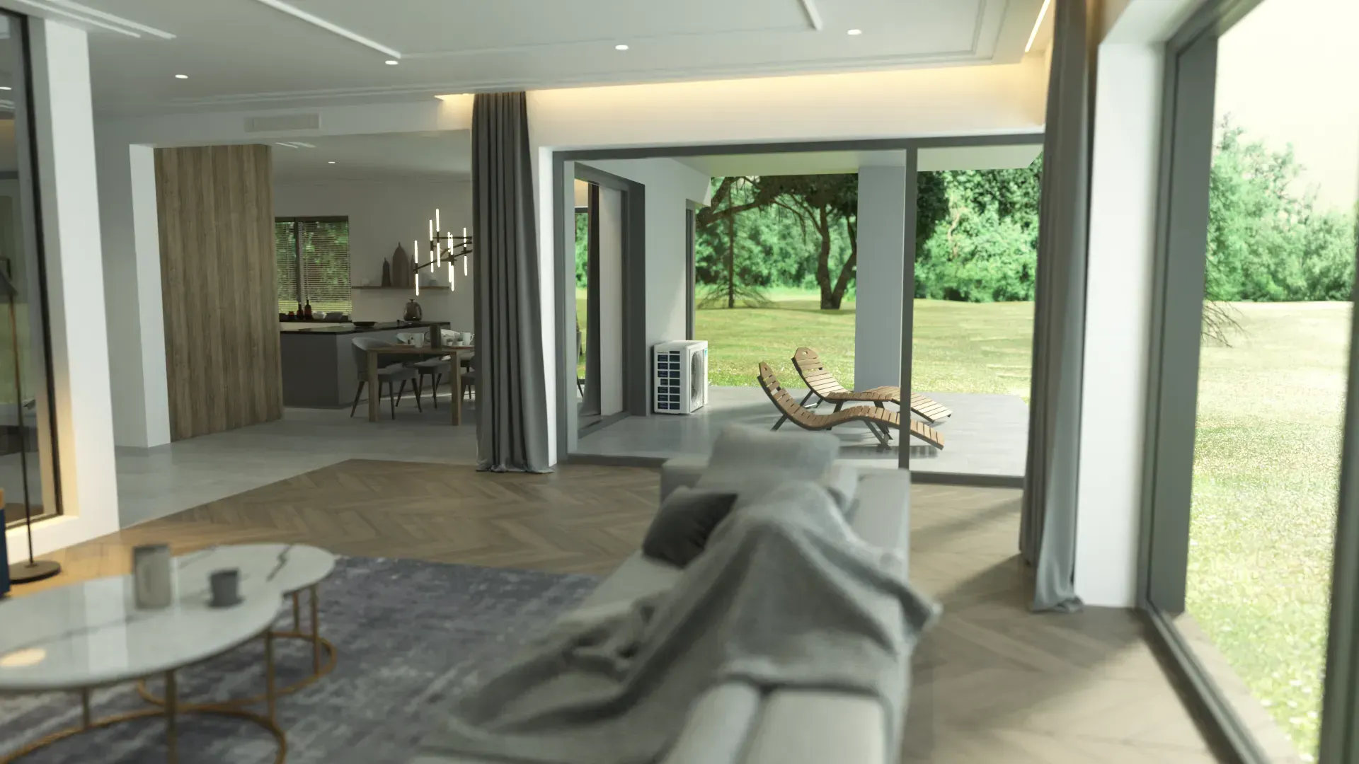 Modern living room with open layout, view of outdoor patio. Light gray sofa, large windows, wooden floors.