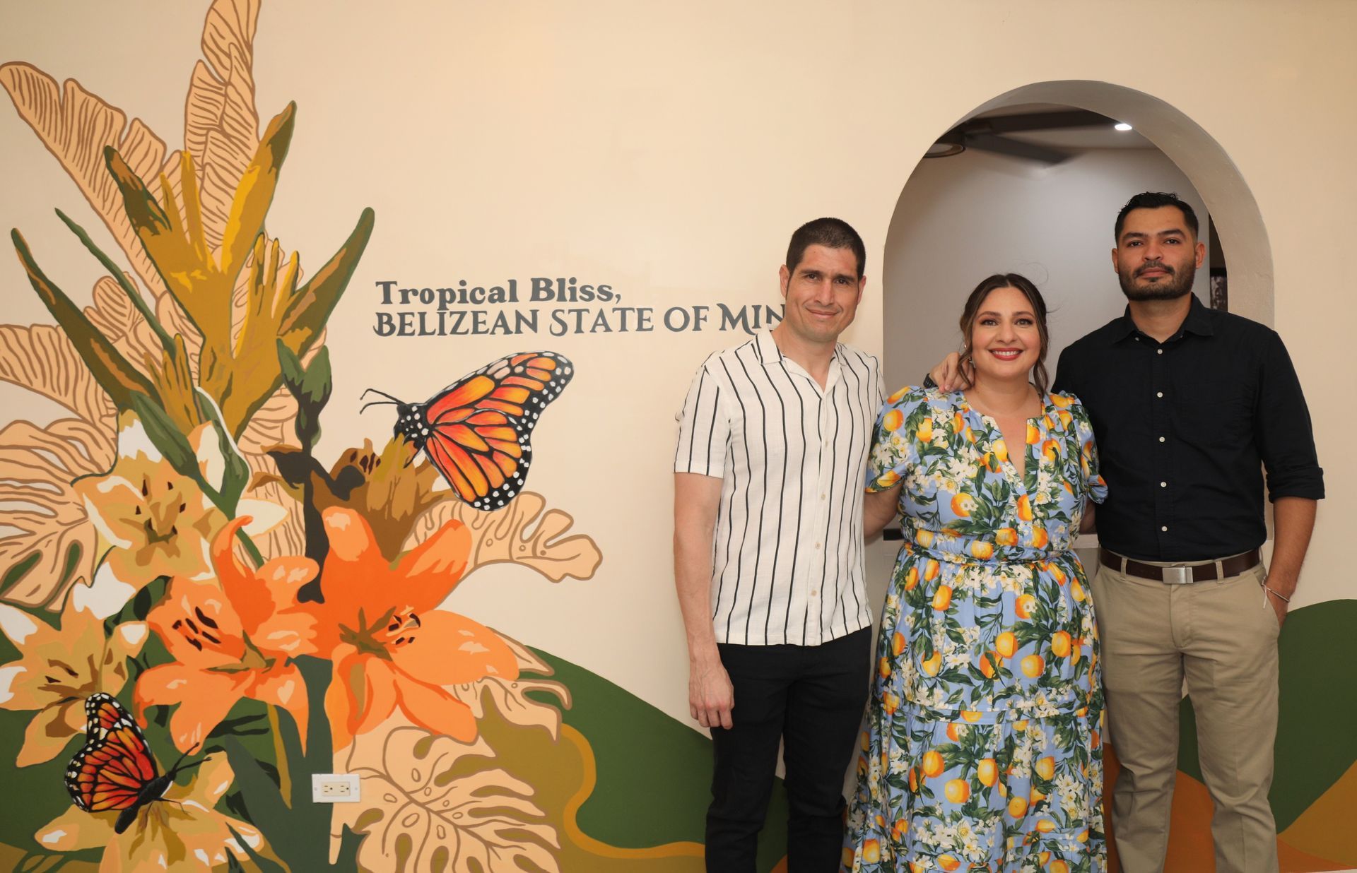 Belizean Artist Pablo Cambranes with a mural he painted at the West House Boutique Hotel in San Ignacio, Belize