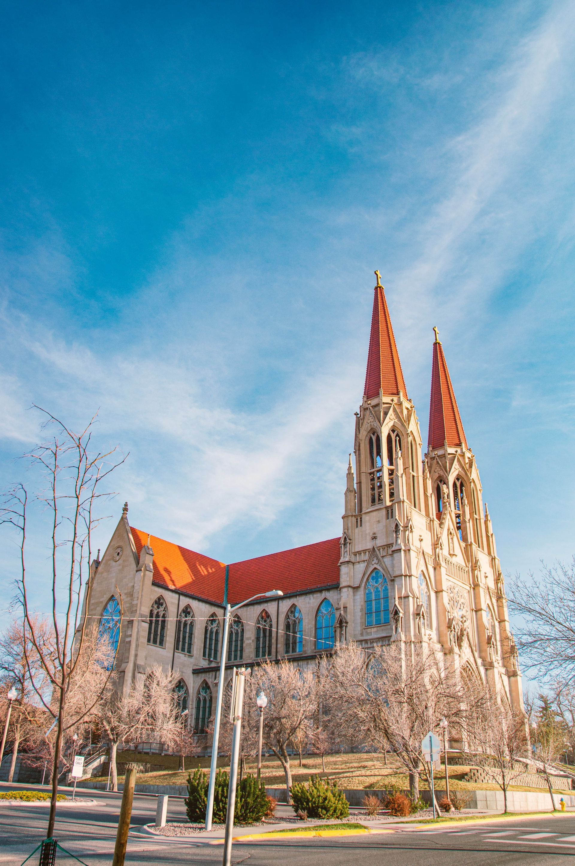A large church with two towers and a red roof.