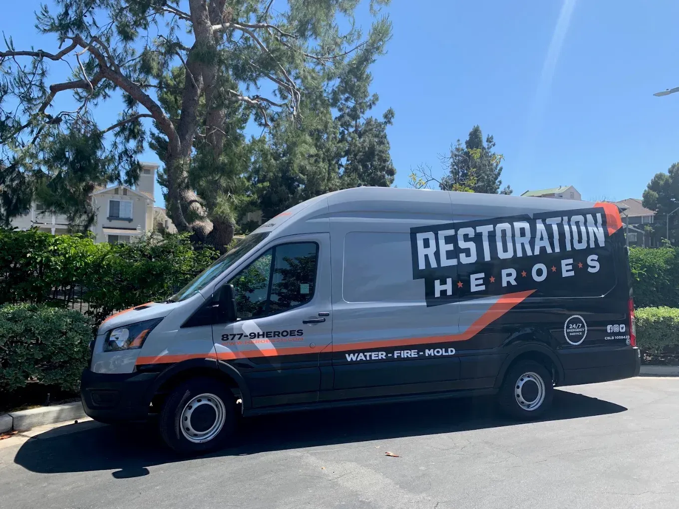 Smoke and odor cleanup service - restoration team van at job site