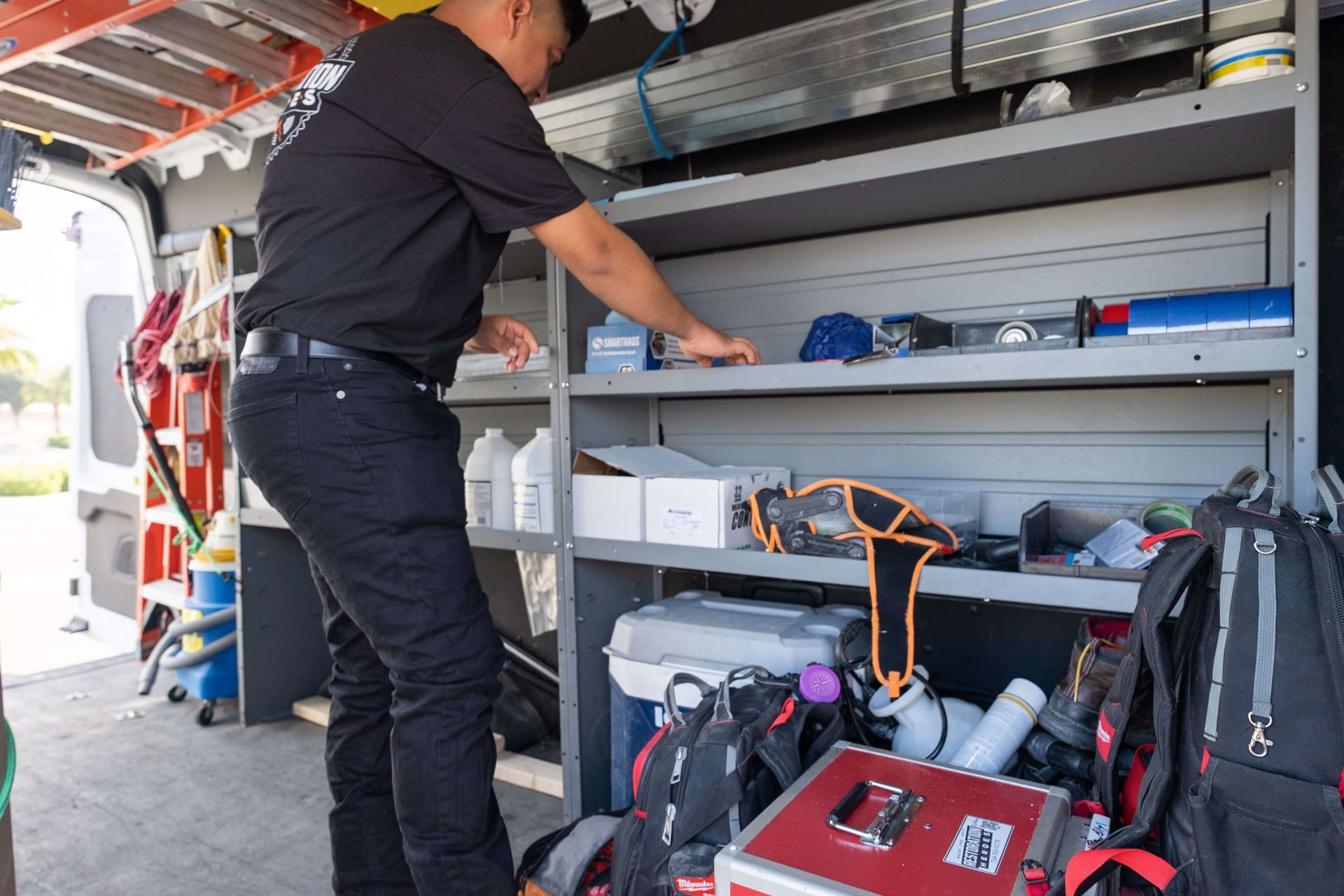 Sewage cleanup service - technician performing sewage remediation