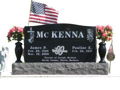 curved headstone with vases