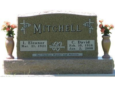 curved headstone with vases