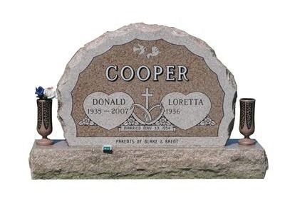 half circle headstone with vases 