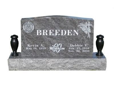 curved headstone with vases