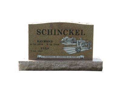 curved headstone with vases
