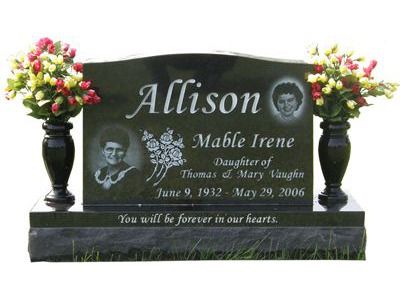 curved headstone with vases