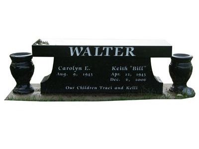flat benchlike headstone with vases