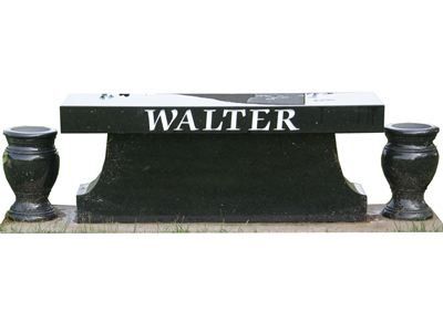 flat benchlike headstone with vases