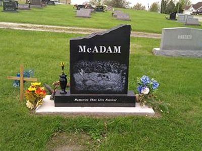 upright headstone with a vase