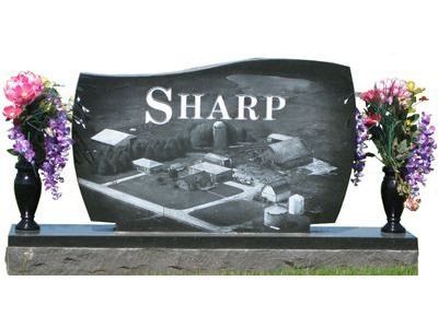 curved headstone with vases