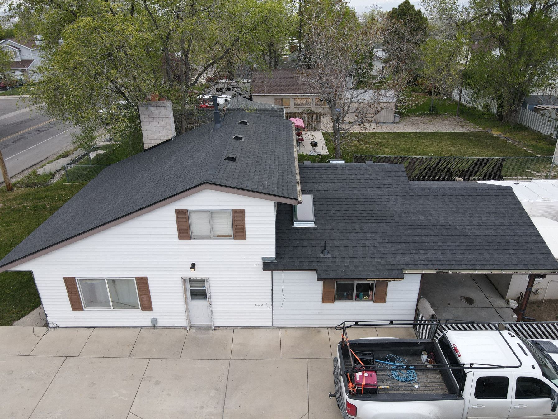 An aerial view of a house with a truck parked in front of it.