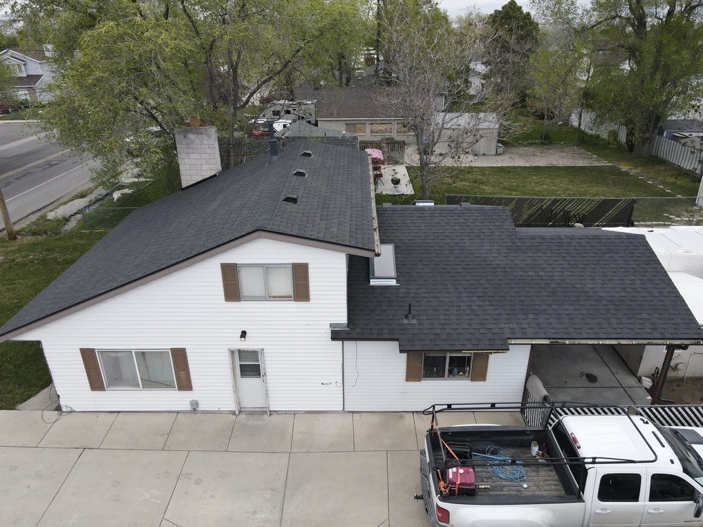 An aerial view of a house with a truck parked in front of it.