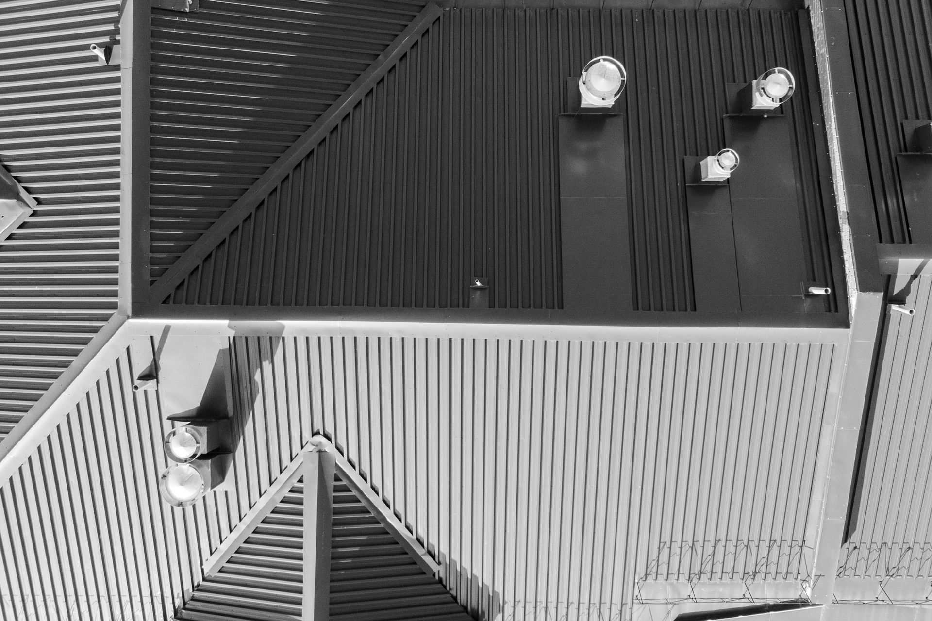 A black and white photo of the roof of a building.