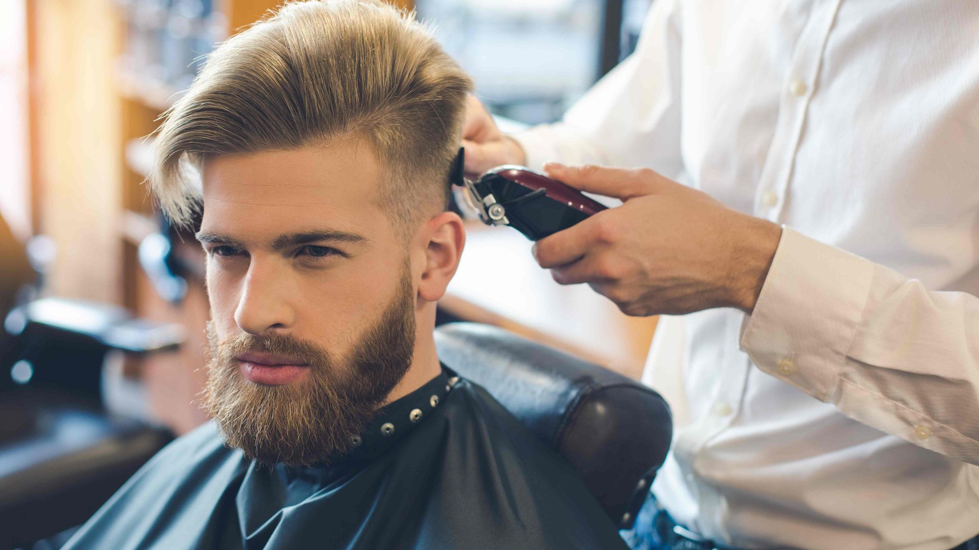 A man getting a new hair cut at Lux Hair Bar near Lexington, Kentucky (KY)