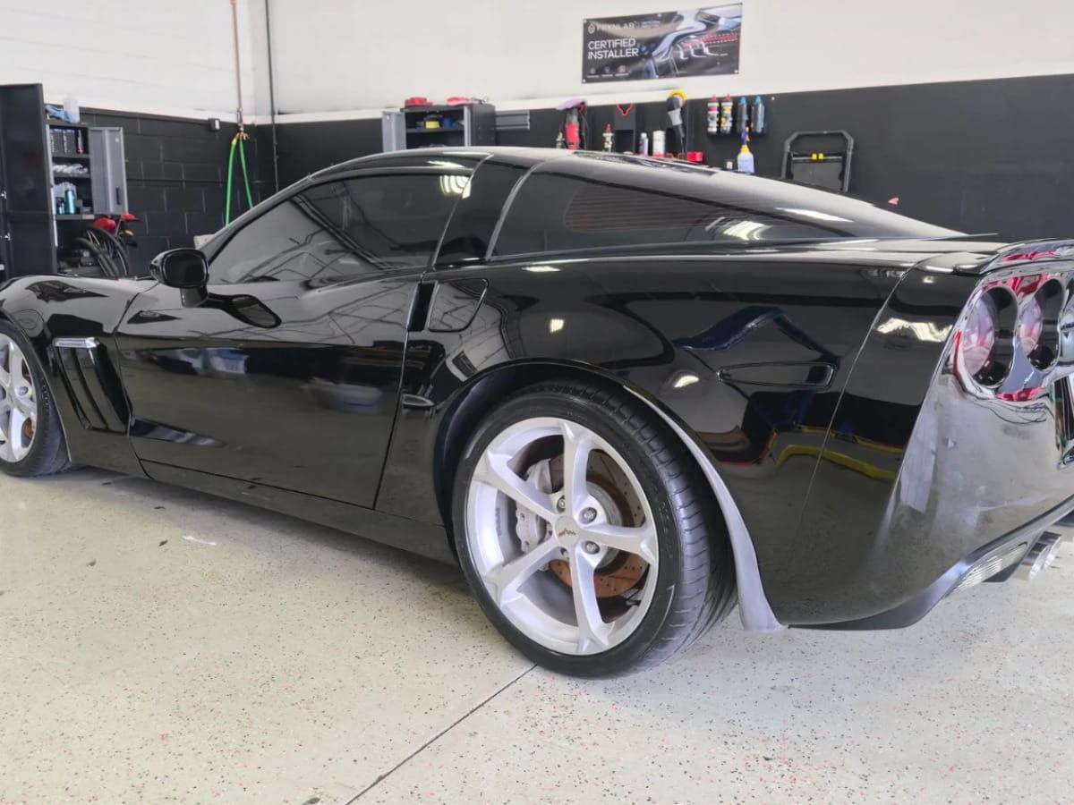 Black Chevrolet Silverado HD inside the Top Tier Detailing shop.