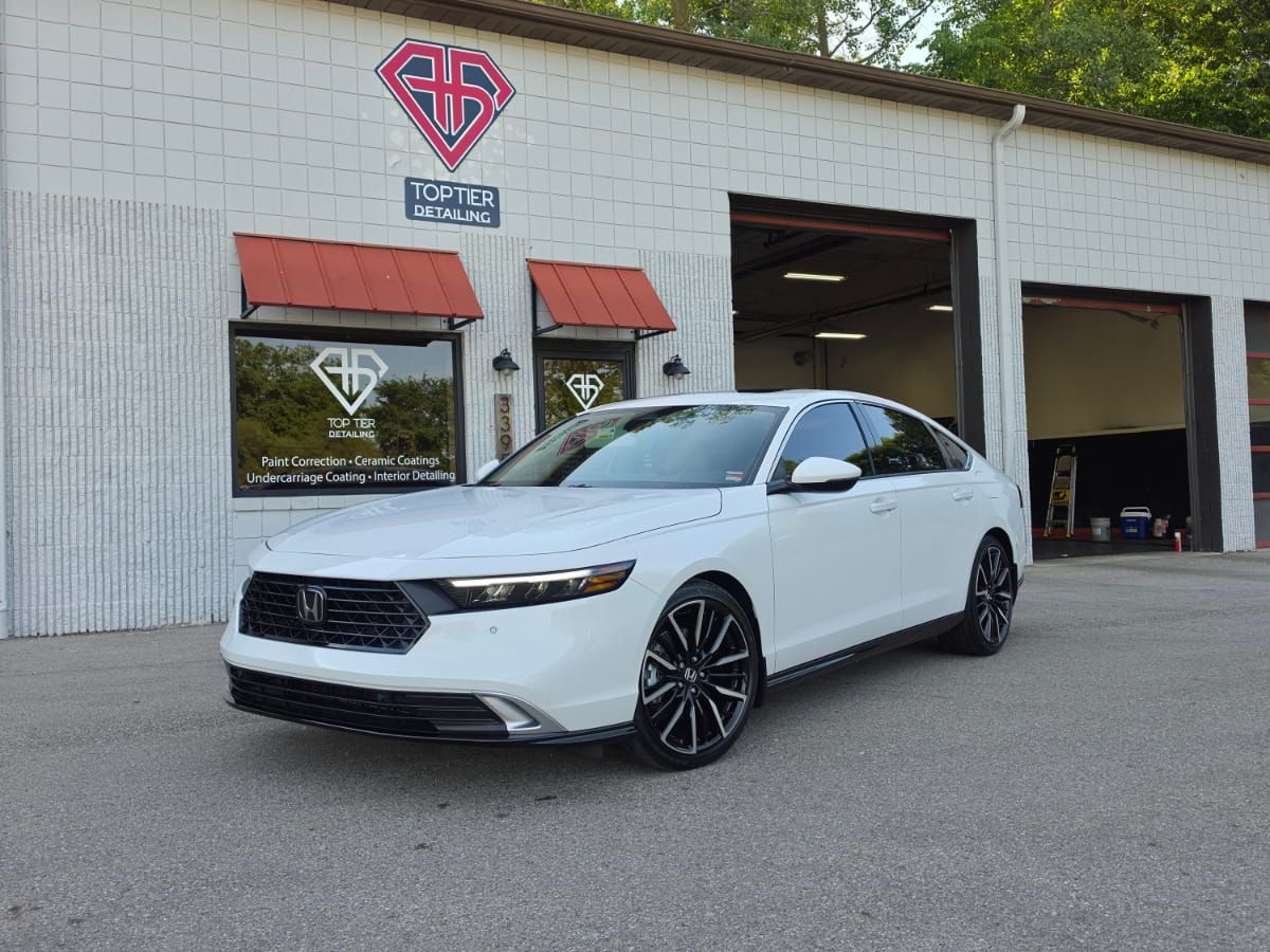 White Honda Accord parked outside Top Tier Detailing in Livonia.