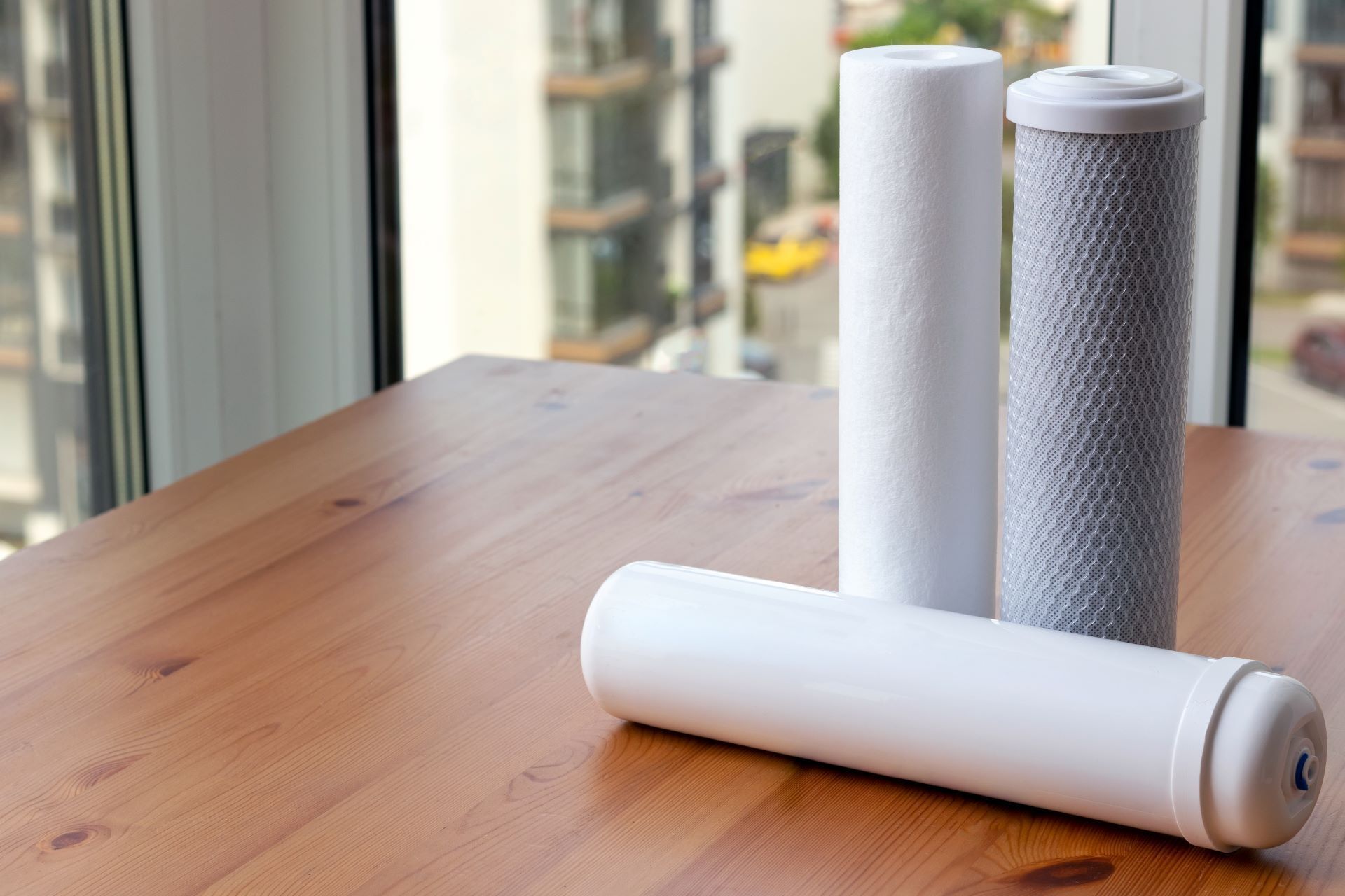 New filter cartridges placed on wooden table