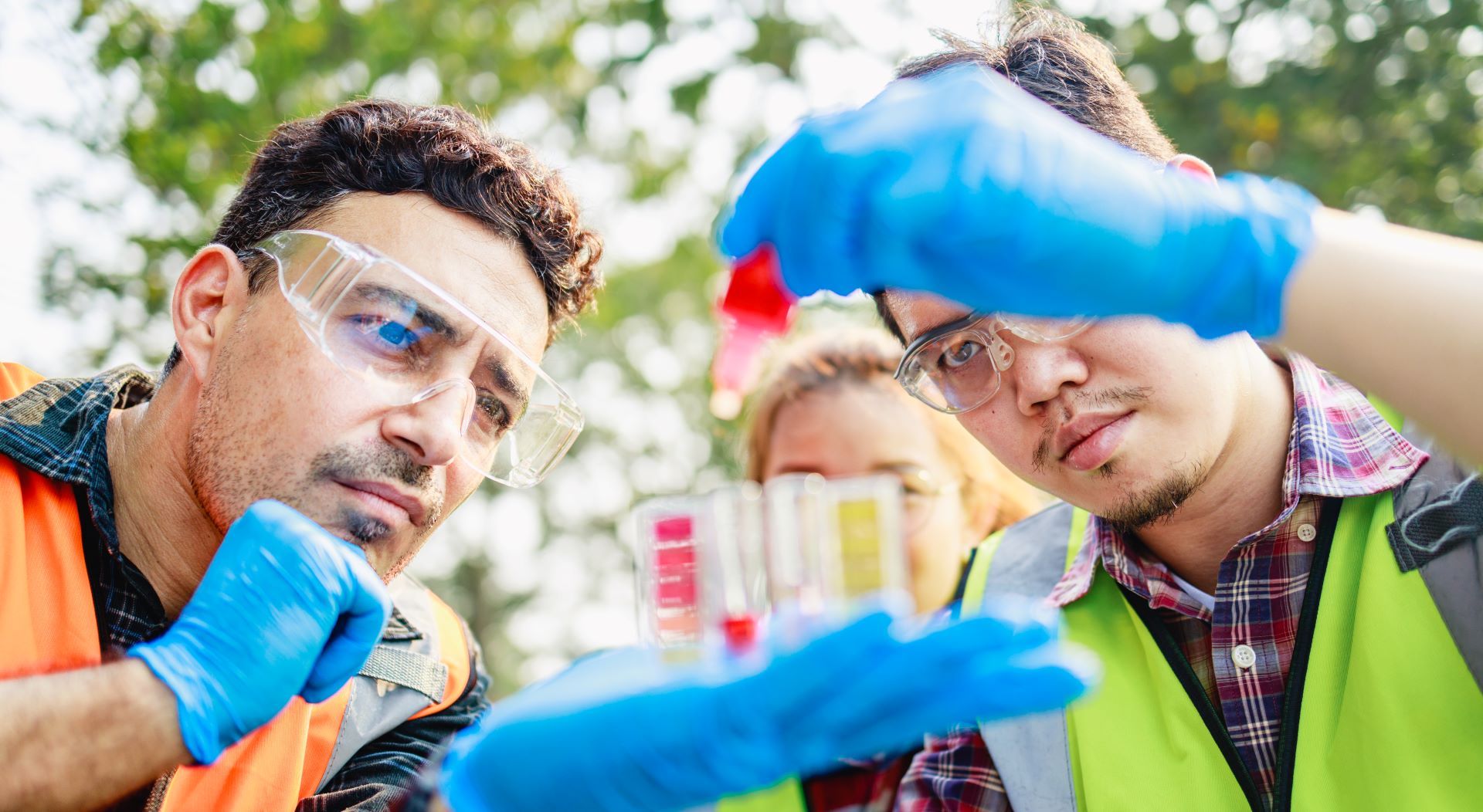 scientists testing samples of wastewater