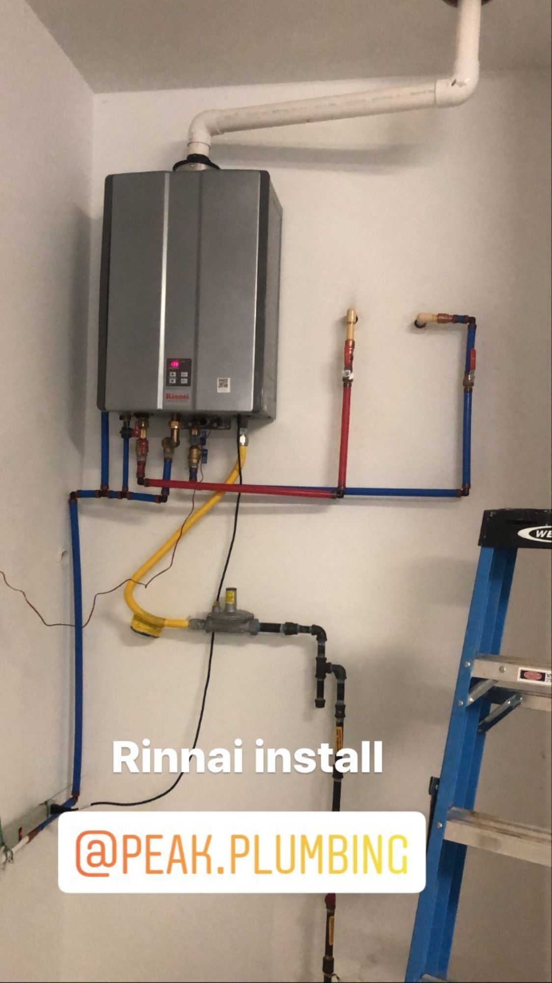A picture of a water heater being installed by peak plumbing